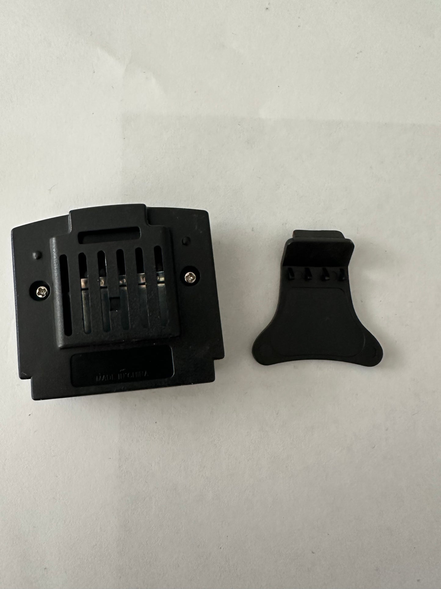 Jumper pak for the Nintendo 64 with removal tool.
